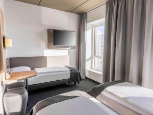 Postel nebo postele na pokoji v ubytování B&B HOTEL Aalborg