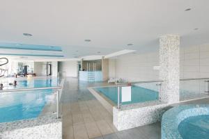 a pool in a hotel with a swimming pool at Villa Horizon-Siófok in Siófok