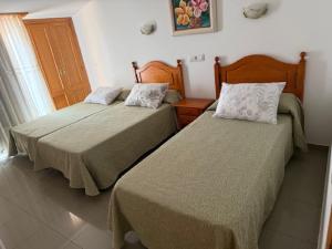 Łóżko lub łóżka w pokoju w obiekcie Hostal Restaurante Pinarejo