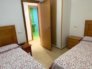 Łóżko lub łóżka w pokoju w obiekcie Hostal Restaurante Pinarejo