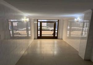 an empty hallway with a door in a building at alojamiento near everything in Valencia +1 photo