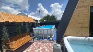 a backyard with a swimming pool and a hot tub at Art House in Yerevan