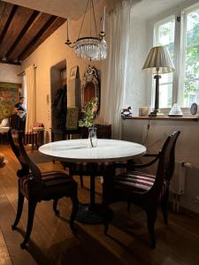 a dining room with a table and chairs at Wabi-Sabi Elegance in Tallinn +23 photos
