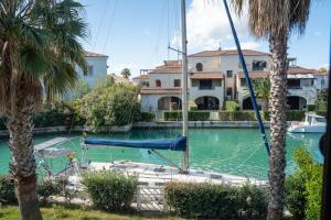 a swimming pool with a blue slide in front of a house at La Maison de l'ile Bora in Policoro