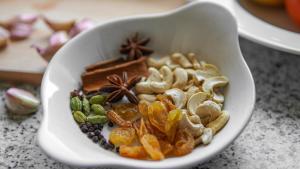 a white bowl filled with nuts and other foods at Kingston Sri lanka in Katugastota