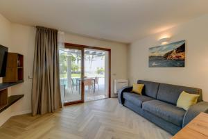 Posezení v ubytování Gardaliva 7 By The Lake