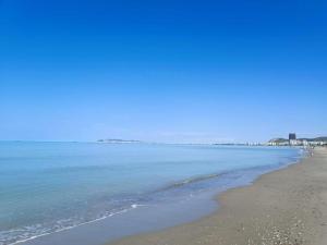 a view of the beach on a clear day at Bora's Apartment, Golem Beach in Golem
