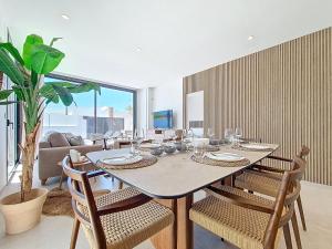 a dining room with a table and chairs at Villa Verano San Javier - 6610 in San Javier
