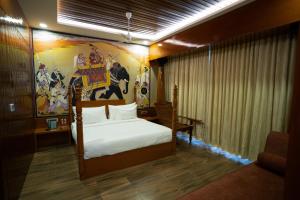 Hotel Sastha Grand客房内的一张或多张床位