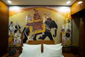 Hotel Sastha Grand客房内的一张或多张床位