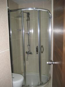 a shower stall with a toilet in a bathroom at Miroglu Hotel in Diyarbakır