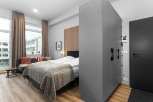 Un ou plusieurs lits dans un hébergement de l'établissement Charming Studio Apartment