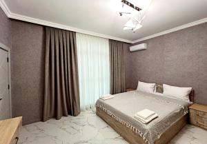 Giường trong phòng chung tại Panorama Deluxe Gabala +61 ảnh