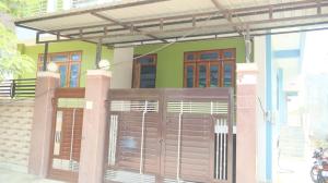 a gate in front of a house with a fence at Hotel Abhinandan Inn in Prayagraj +8 photos