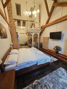 a large bedroom with a large bed in a building at La Opt Apartments in Oradea