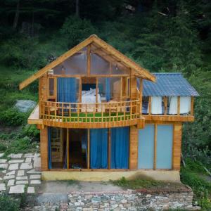 a model of a house with a balcony at Glass House by Himalayan Cedar Nest in Sainj