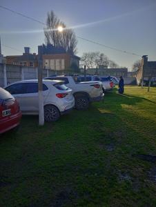 a group of cars parked in a grass field at Mar y Cielo in Necochea +50 photos