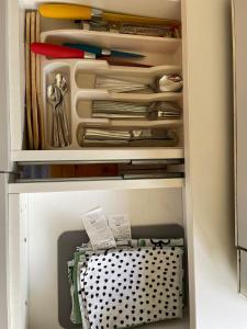 a drawer filled with lots of utensils at Ivaa in Nova Varoš