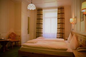Letto o letti in una camera di Schatzalp Hotel