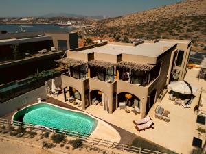 an aerial view of a house with a swimming pool at No908 Sunset HOTEL in Çeşme