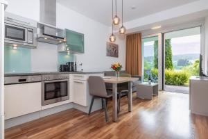A kitchen or kitchenette at Apartments Schluga