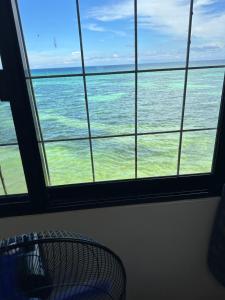 a view of the ocean from a window at Becca's Vacation House 