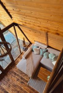 an overhead view of a couch in a room at Cozy Cabin House in Novi Pazar