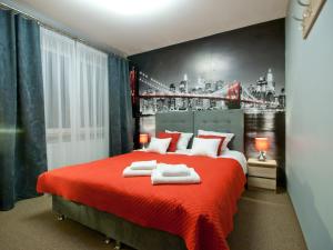 Posteľ alebo postele v izbe v ubytovaní Apartamenty studio Metropolio Centrum