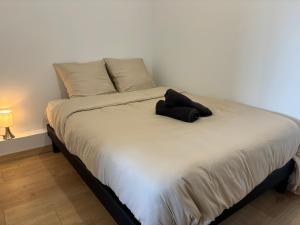 Postel nebo postele na pokoji v ubytování L'Horizon I T2