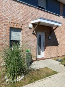 ブットヤーディンゲンにあるModernes Ferienhaus Wattwurm in Tossensのギャラリーの写真