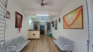 a hallway with chairs and a podium in a room at Sri Annapurna Residency in Drākshārāma