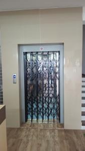 a door with a metal gate in a building at Sri Annapurna Residency in Drākshārāma
