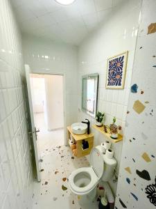 a bathroom with a toilet and a sink at Chic Design Stay With a Chocolate Welcome Gift in Agadir +17 photos