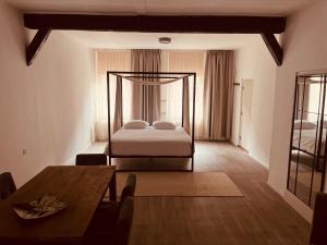 a bedroom with a bed in the middle of a room at naMaaStay in Maastricht
