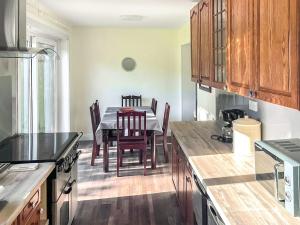 a kitchen with a table and a dining room at Pillango in Cowes