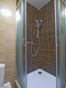 Kúpeľňa v ubytovaní Apartamenty studio Metropolio Centrum