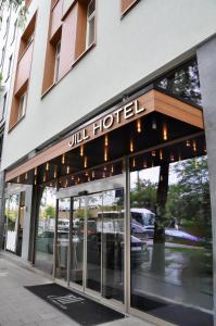 a building with a hotel sign on the front of it at Jill Hotel Brussels in Brussels