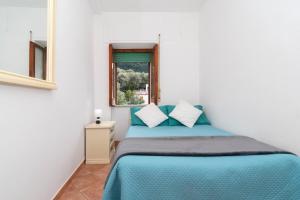 Ένα ή περισσότερα κρεβάτια σε δωμάτιο στο Casa Melo