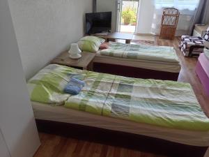 A bed or beds in a room at Apartmany Fantagiro