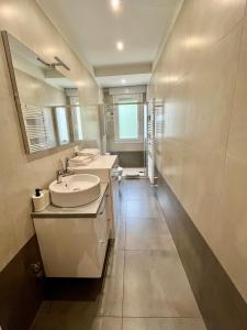 a bathroom with a sink and a mirror at Yaya's House - Venice in Mestre +9 photos