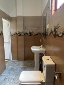 a bathroom with a toilet and a sink at Ceylon Cecilia Villa in Galle +40 photos