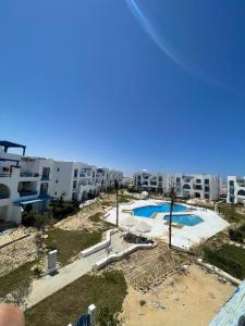 arial view of a swimming pool at a apartment at Boho Breez Mountain View Chalet in Ras Elhekma