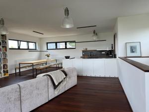 a living room with a couch and a table at Ferienwohnung Faulhauer in Welschbillig