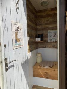 a small bathroom with a toilet in a room at Le dôme du Bonheur in Tourtouse