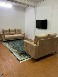 TV/trung tâm giải trí tại Homestay Losong Kuala Terengganu