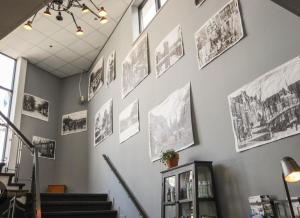 a wall with pictures hanging on a wall at Boutique Hotel Pake Klaas in Sneek