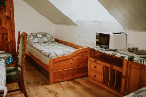 a bedroom with a bed and a microwave on a counter at Willa Murena in Mielno +60 photos