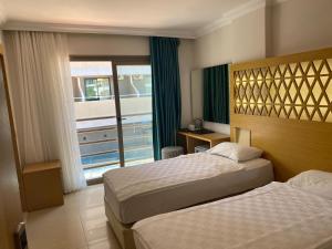 Postel nebo postele na pokoji v ubytování Aurasia Design Hotel + 37 fotografií