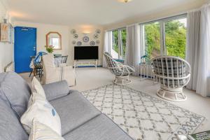 a living room with a couch and a tv at 2 Bed in Padstow oc-t32456 in Padstow
