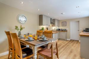 a kitchen and dining room with a table and chairs at 3 Bed in Reeth oc-l32438 in Reeth